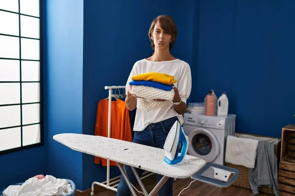 Brunette Woman Holding Folded Laundry Ironing Depressed Worry Distress Crying — Stock Photo, Image