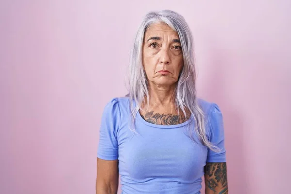 Middle Age Woman Tattoos Standing Pink Background Depressed Worry Distress — Stock Photo, Image