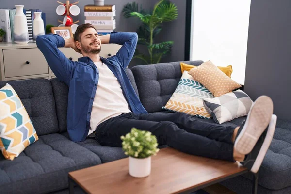 Young Caucasian Man Relaxed Hands Head Sitting Sofa Home — Stock Photo, Image