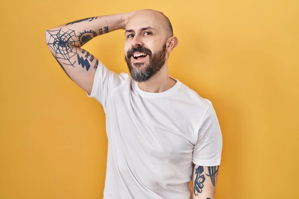 Young Hispanic Man Tattoos Standing Yellow Background Smiling Confident Touching — Fotografia de Stock