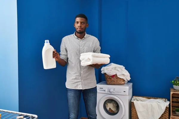 African American Man Holding Clean Towels Relaxed Serious Expression Face — Stock Photo, Image