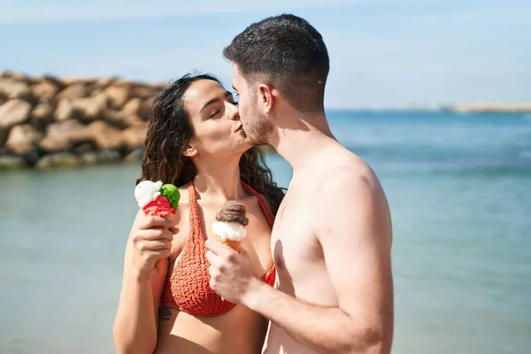 Young Hispanic Couple Tourists Wearing Swimsuit Eating Ice Cream Seaside — 스톡 사진