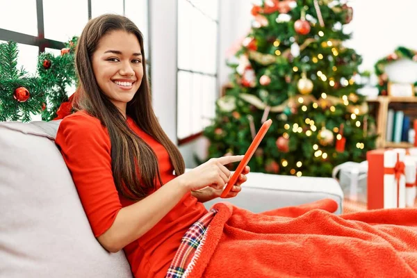 Young Latin Woman Using Touchpad Sitting Christmas Tree Home — Fotografia de Stock