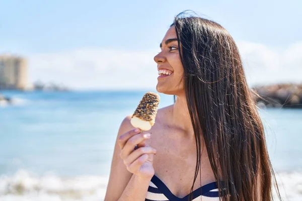 Young Hispanic Woman Wearing Bikini Eating Ice Cream Seaside — Zdjęcie stockowe