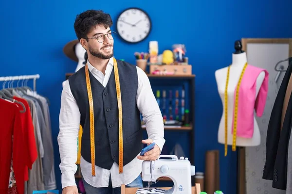 Young Hispanic Man Tailor Smiling Confident Using Smartphone Sewing Studio — Stock Photo, Image