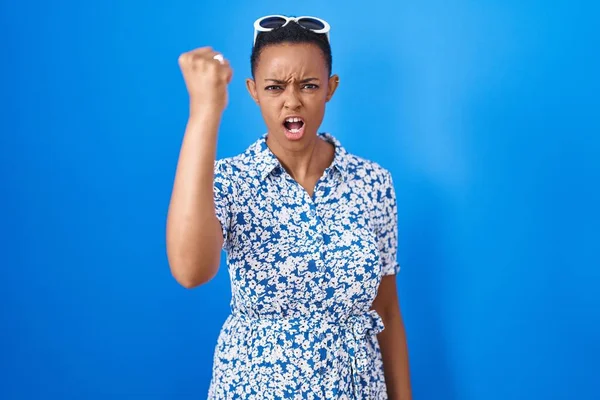 African American Woman Standing Blue Background Angry Mad Raising Fist — Stock Photo, Image