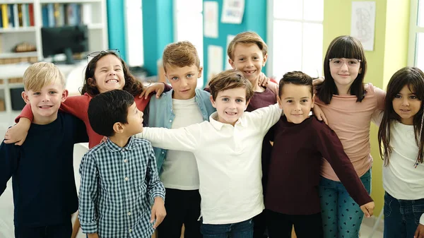 Group Kids Students Smiling Confident Hugging Each Other Classroom — Stock Photo, Image