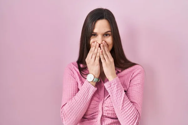 Young Hispanic Woman Standing Pink Background Laughing Embarrassed Giggle Covering — Zdjęcie stockowe