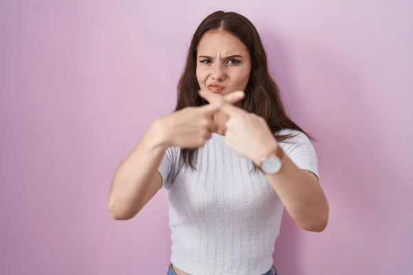 Young Hispanic Girl Standing Pink Background Rejection Expression Crossing Fingers — Stock Photo, Image