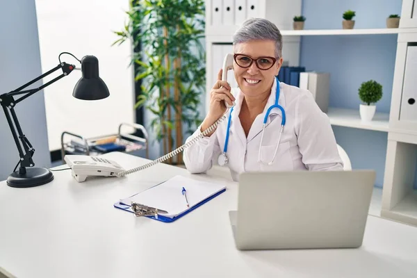 Middle Age Woman Wearing Doctor Uniform Talking Telephone Clinic — Stock Photo, Image