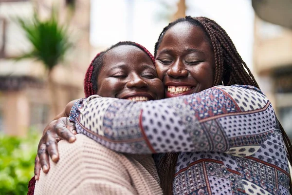African American Women Friends Smiling Confident Hugging Each Other Street — Φωτογραφία Αρχείου
