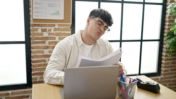 Young Hispanic Man Business Worker Using Laptop Reading Document Office — Fotografia de Stock