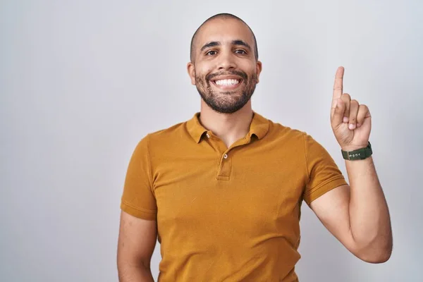 Hispanic Man Beard Standing White Background Pointing Finger Successful Idea — стоковое фото