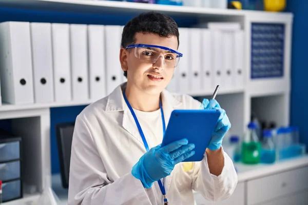 Young Non Binary Man Scientist Smiling Confident Write Touchpad Laboratory — Stock Photo, Image
