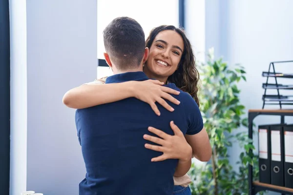 Young Hispanic Couple Business Workers Hugging Each Other Standing Office — Photo