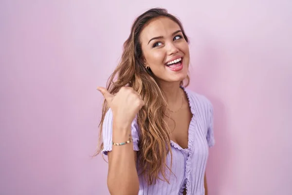 Young Hispanic Woman Standing Pink Background Smiling Happy Face Looking — Stock fotografie