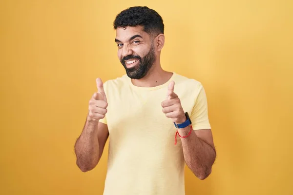 Hispanic Man Beard Standing Yellow Background Pointing Fingers Camera Happy — Stock Photo, Image
