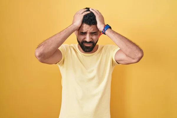Hispanic Man Beard Standing Yellow Background Suffering Headache Desperate Stressed — Φωτογραφία Αρχείου
