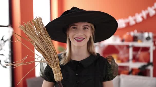 Young Blonde Woman Wearing Witch Costume Holding Broom Home — Stock Video