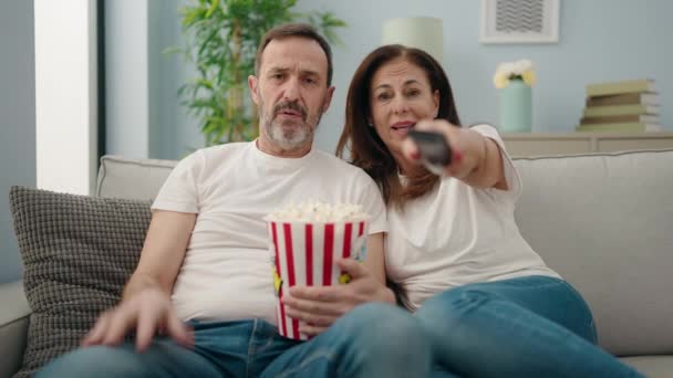 Man Woman Couple Watching Movie Sitting Sofa Home — Video