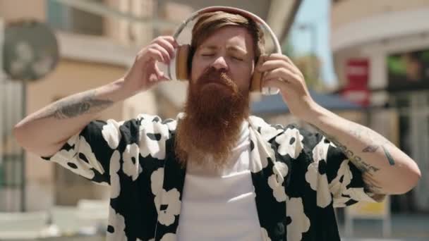 Young Redhead Man Listening Music Dancing Street — Stockvideo