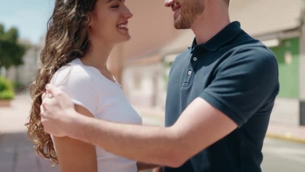 Young Hispanic Couple Smiling Confident Hugging Each Other Street — Stockvideo