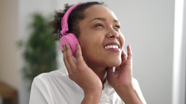African American Woman Listening Music Standing Home — Stockvideo