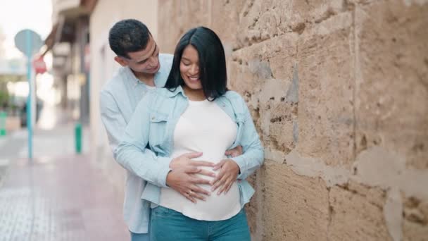 Young Latin Couple Smiling Confident Touching Belly Standing Street — Video Stock