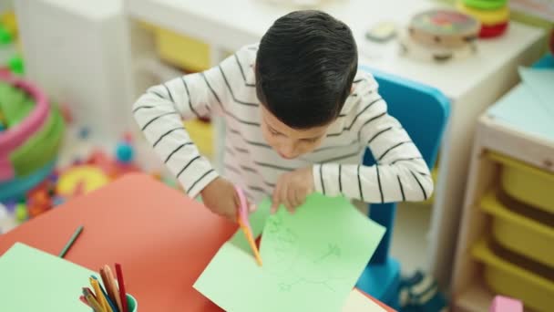 Adorable Hispanic Boy Student Cutting Paper Kindergarten — Video Stock