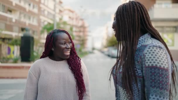 Two African American Women Smiling Confident Speaking Street — Stockvideo