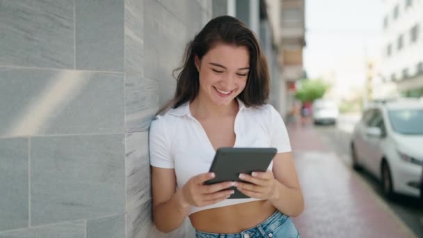 Young Hispanic Woman Smiling Confident Using Touchpad Street — стоковое видео