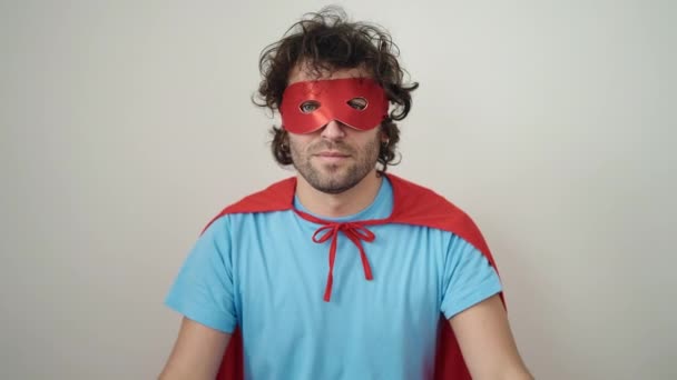 Young Hispanic Man Wearing Superhero Costume Doing Strong Gesture Arms — Wideo stockowe
