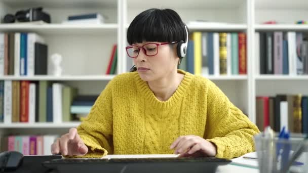 Young Chinese Woman Student Reading Book Studying Library University — Vídeo de Stock