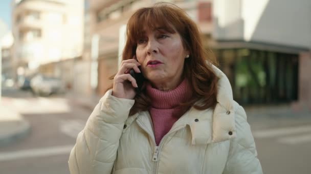 Middle Age Redhead Woman Talking Smartphone Street — стоковое видео