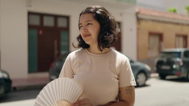 Young Woman Using Handfan Street — Stockvideo
