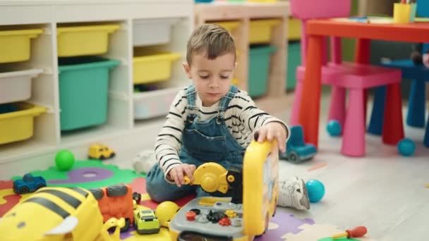 Adorable Caucasian Boy Playing Toys Sitting Floor Kindergarten — Stockvideo