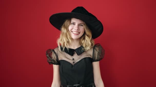 Young Blonde Woman Wearing Witch Costume Holding Halloween Pumpkin Basket — Vídeo de stock