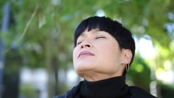 Young Chinese Woman Breathing Closed Eyes Park — Video Stock