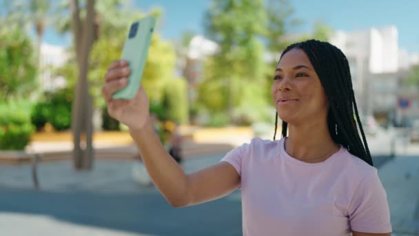 African American Woman Smiling Confident Having Video Call Street — стоковое видео