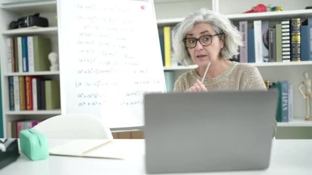 Middle Age Woman Grey Hair Teacher Teaching Online Maths Lesson — Vídeo de stock