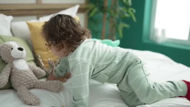 Adorable Hispanic Girl Hugging Teddy Bear Lying Bed Bedroom — Video