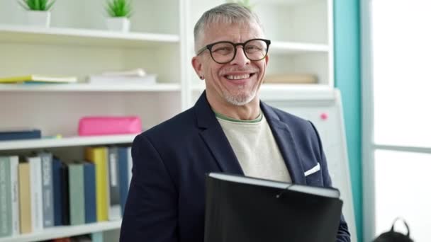 Middle Age Grey Haired Man Teacher Smiling Confident Holding Folder — Stock Video