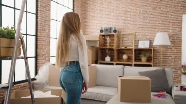 Young Blonde Woman Smiling Confident Standing New Home — Wideo stockowe