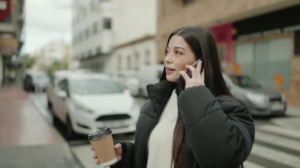 Young Hispanic Woman Talking Smartphone Drinking Coffee Street — Vídeo de Stock