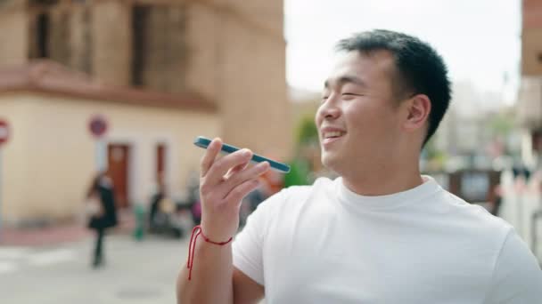 Young Chinese Man Smiling Confident Talking Smartphone Street — Stok video