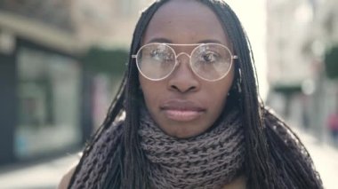 African woman smiling confident at street