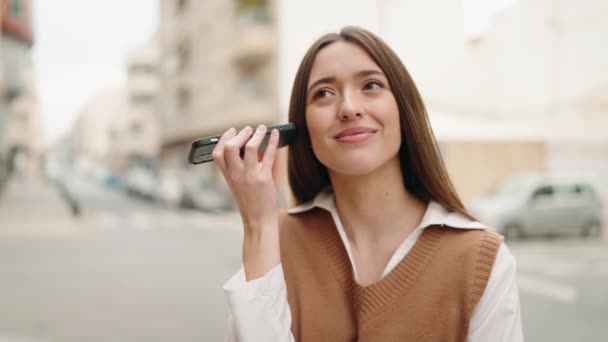 Young Hispanic Woman Smiling Confident Listening Audio Message Smartphone Street — Wideo stockowe