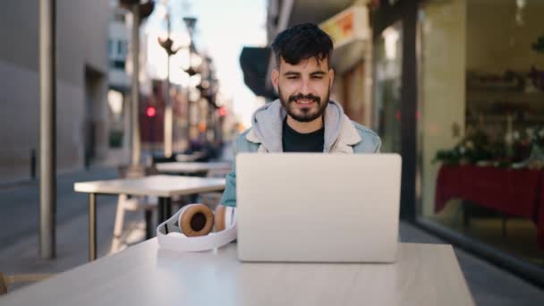 Young Hispanic Man Listening Music Sitting Table Coffee Shop Terrace — Wideo stockowe