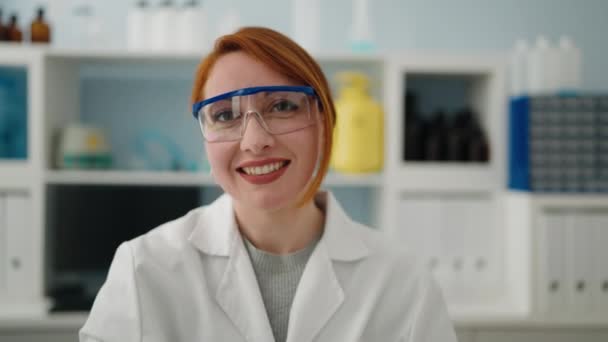 Young Redhead Woman Wearing Scientist Uniform Holding Test Tube Laboratory — Stock video