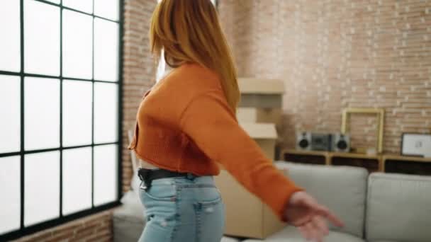 Young Redhead Woman Smiling Confident Standing Arms Open New Home — Stockvideo